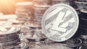 Image of one litecoin in front of many stacks of litecoins